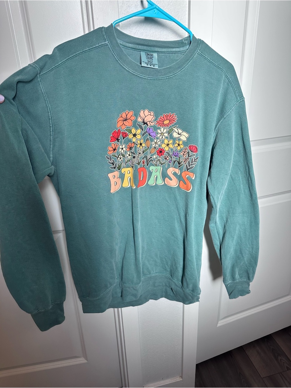 Comfort Colors teal crewneck with multicolor floral BADASS graphic